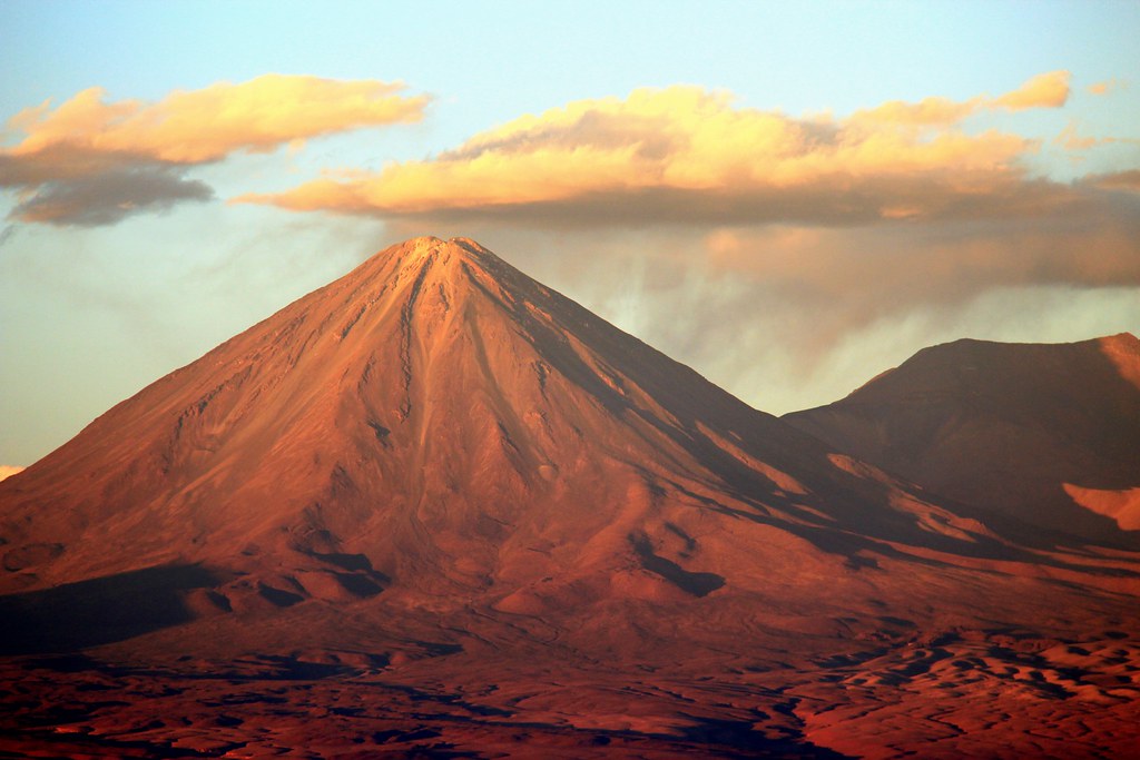 Licancabur volcano glowing red at sunset in the Atacama Desert
